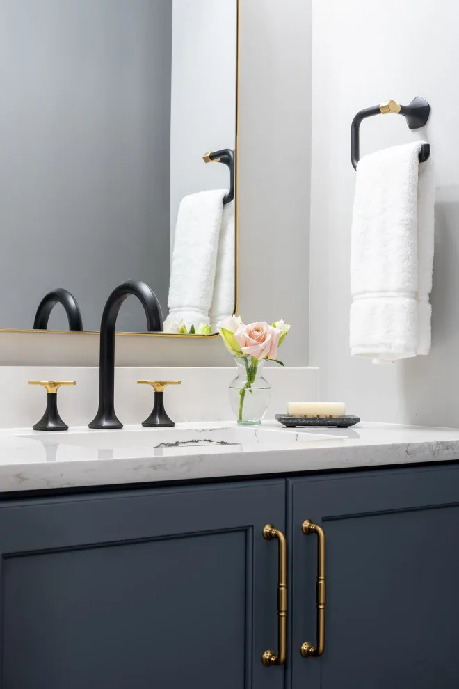 Stylish bathroom featuring smart storage solutions and artistic design elements by Liston Design Build - Photo 4