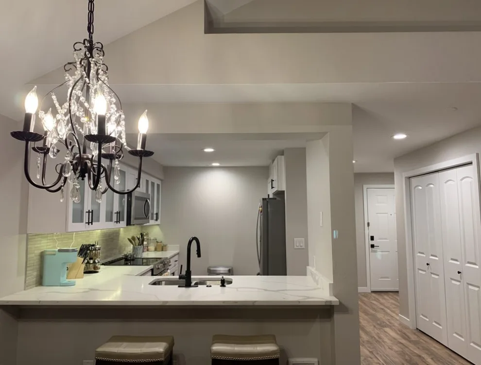 Contemporary White Kitchen Renovation by Wise Choice Construction - Photo 3