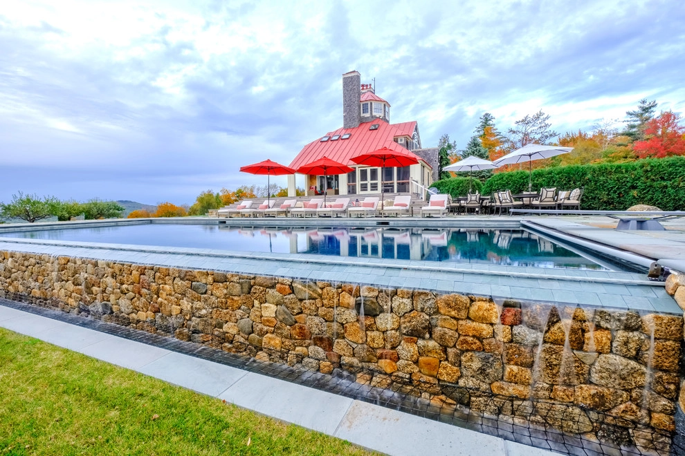Vanishing Edge Pool with Bluestone Patio & Outdoor Fireplace by Pellettieri Associates, Inc. - Photo 8