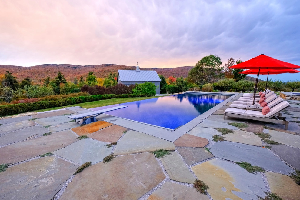Vanishing Edge Pool with Bluestone Patio & Outdoor Fireplace by Pellettieri Associates, Inc. - Photo 7