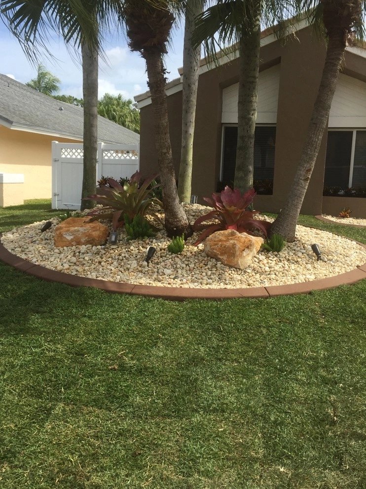 Tamarac Front yard Redesign by Pink And Green Lawn Care And Landscape - Photo 3