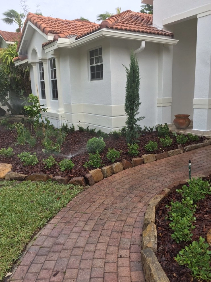 Pembroke Pines, FL Front Yard Redesign by Pink And Green Lawn Care And Landscape - Photo 3