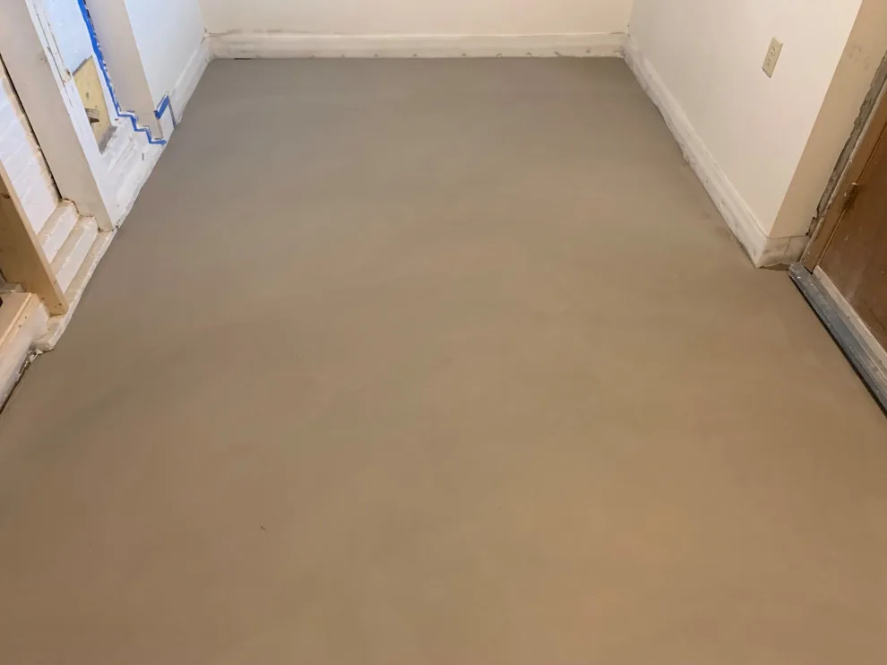 Basement leveling and flooring installation (Before and After) by Ultimate Remodeling - Photo 5