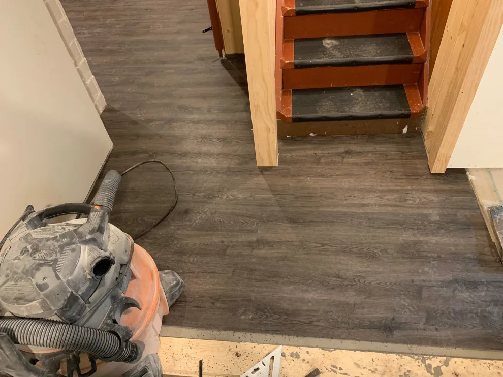 Basement leveling and flooring installation (Before and After) by Ultimate Remodeling - Photo 6