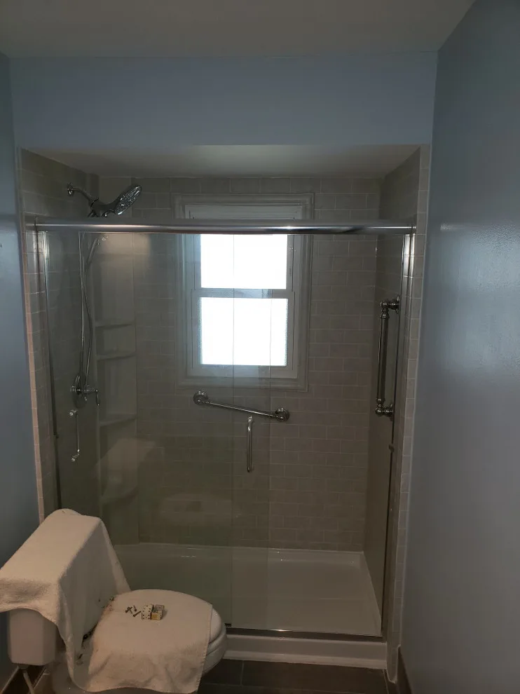 Roman Stone Simtile with Semi-Frameless Bypass Doors and Window Set by AAA Remodeling Of Central Florida - Photo 2