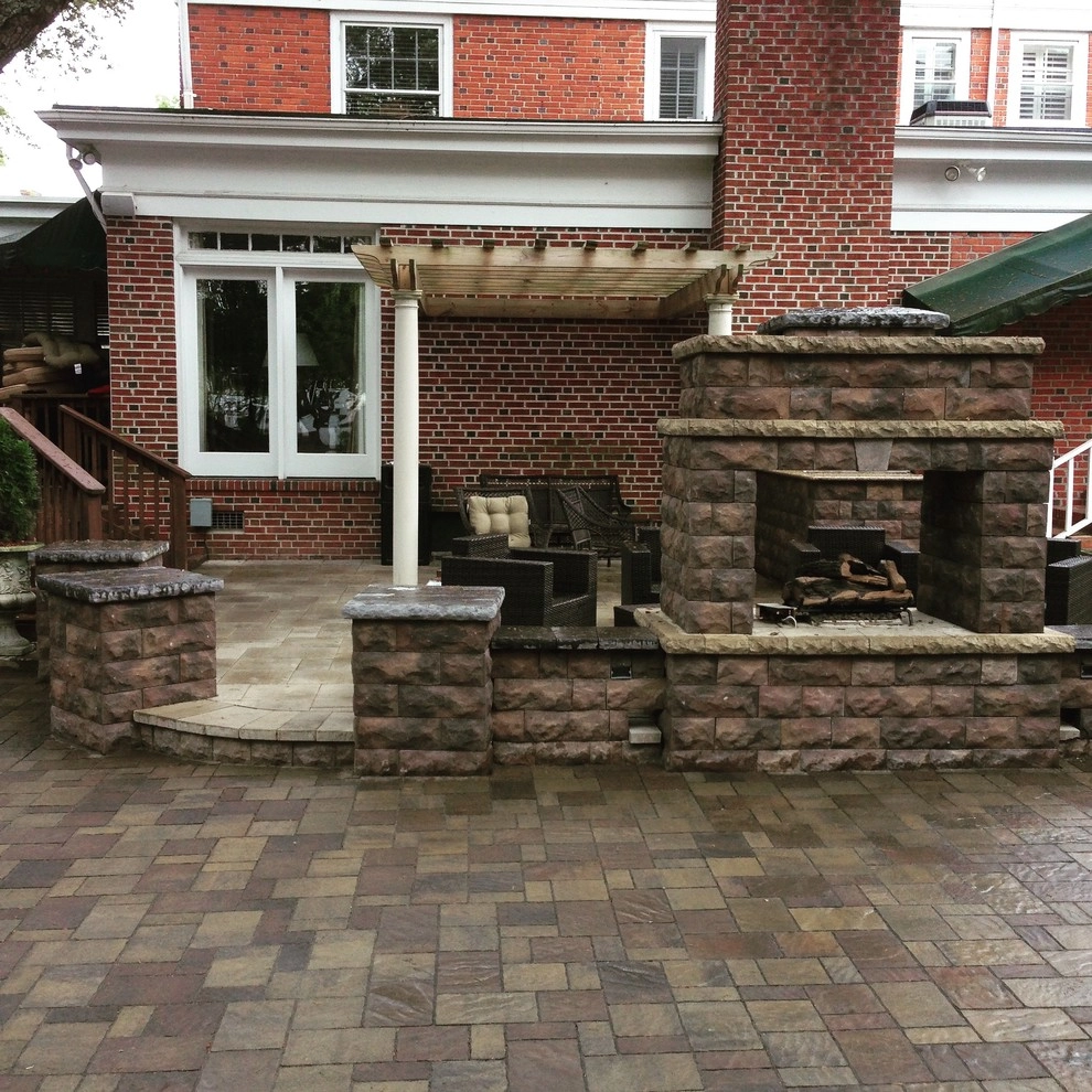 Custom Fireplace and Raised Patio by Premiere Landscape Design - Photo 4