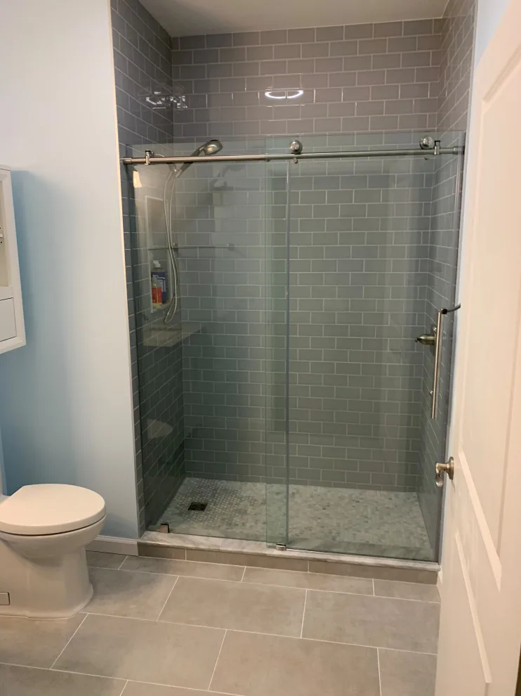 Compact bathroom featuring a walk-in shower by All Over IT Renovations - Photo 4