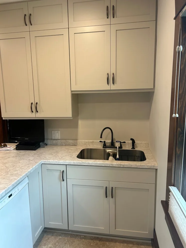 Kitchen Renovation Featuring New Morning Dew Colored Cabinets by Kitchen Solvers Of Eau Claire - Photo 9