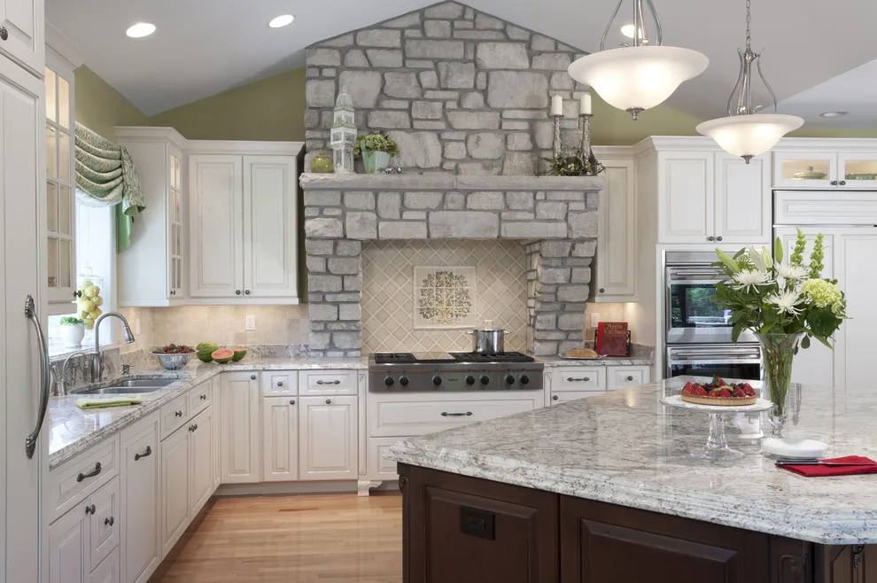 Classic Kitchen with Large Stone Vent Hood by Lorrien Homes & Remodeling - Photo 5