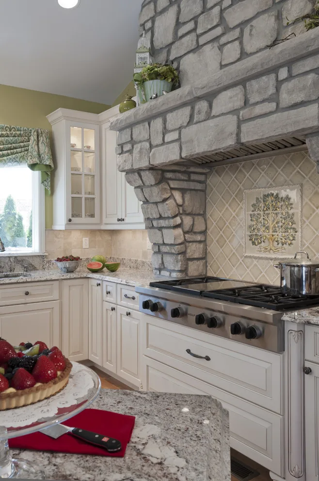 Classic Kitchen with Large Stone Vent Hood by Lorrien Homes & Remodeling - Photo 4