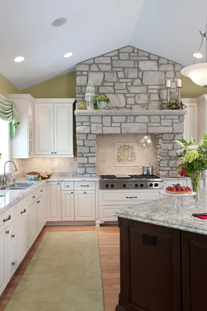 Classic Kitchen with Large Stone Vent Hood by Lorrien Homes & Remodeling - Photo 6