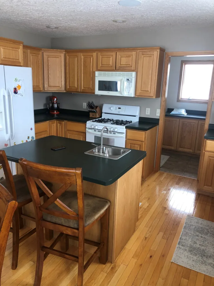 Contemporary Kitchen Renovation Through Cabinet Refacing by Kitchen Solvers Of Eau Claire - Photo 3