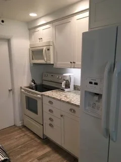 Rehoboth Beach Apartment by Whitney Garrett / Kenwood Kitchens - Photo 9