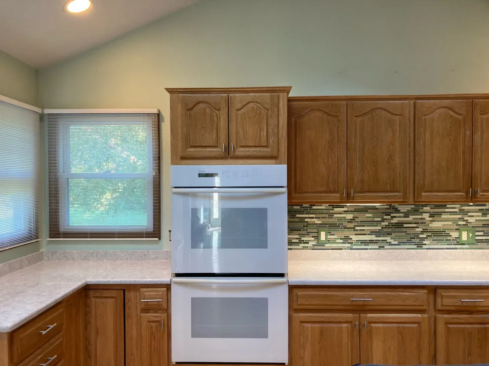 Classic Kitchen Renovation in Snow White with Walnut Glaze by Kitchen Solvers Of Grayslake - Photo 22