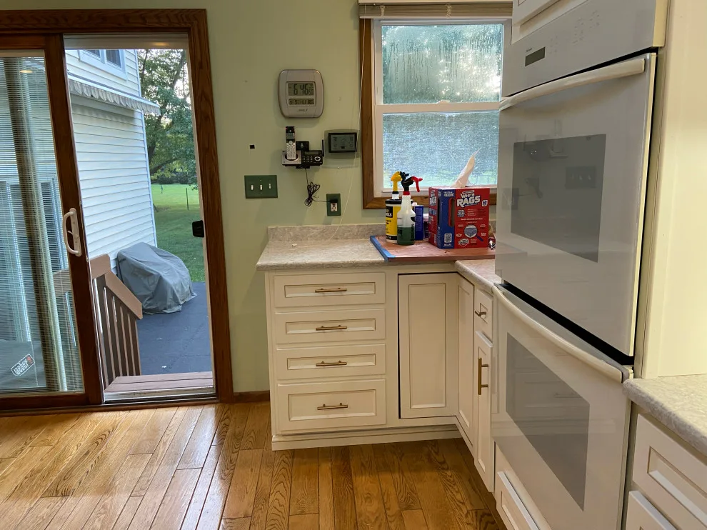 Classic Kitchen Renovation in Snow White with Walnut Glaze by Kitchen Solvers Of Grayslake - Photo 19