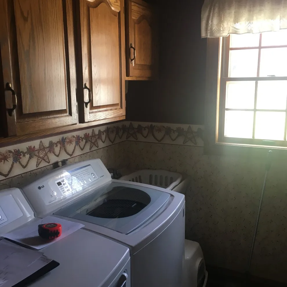 Biscuit-Colored Kitchen Renovation with Chocolate Glaze by Kitchen Solvers Of Eau Claire - Photo 16