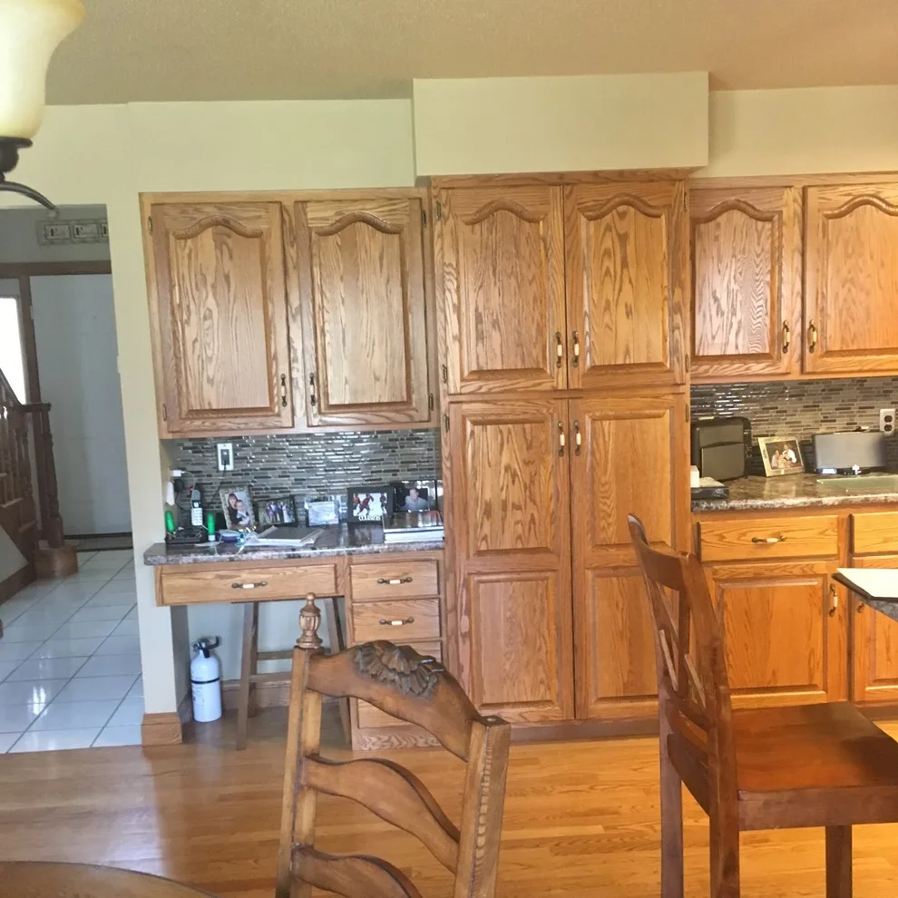 Biscuit-Colored Kitchen Renovation with Chocolate Glaze by Kitchen Solvers Of Eau Claire - Photo 12
