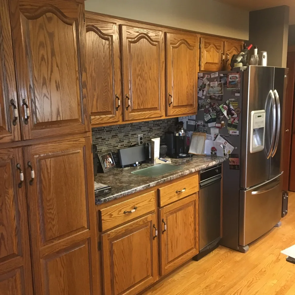 Biscuit-Colored Kitchen Renovation with Chocolate Glaze by Kitchen Solvers Of Eau Claire - Photo 11