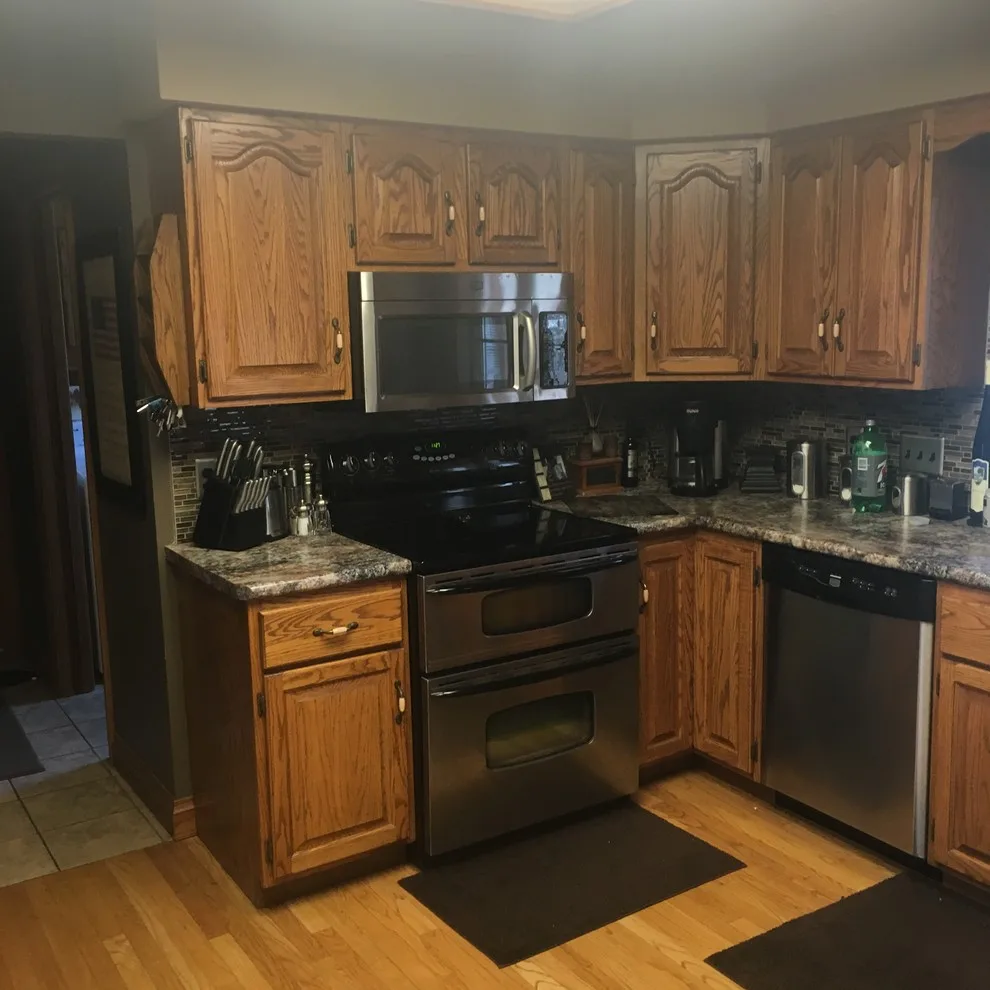 Biscuit-Colored Kitchen Renovation with Chocolate Glaze by Kitchen Solvers Of Eau Claire - Photo 4