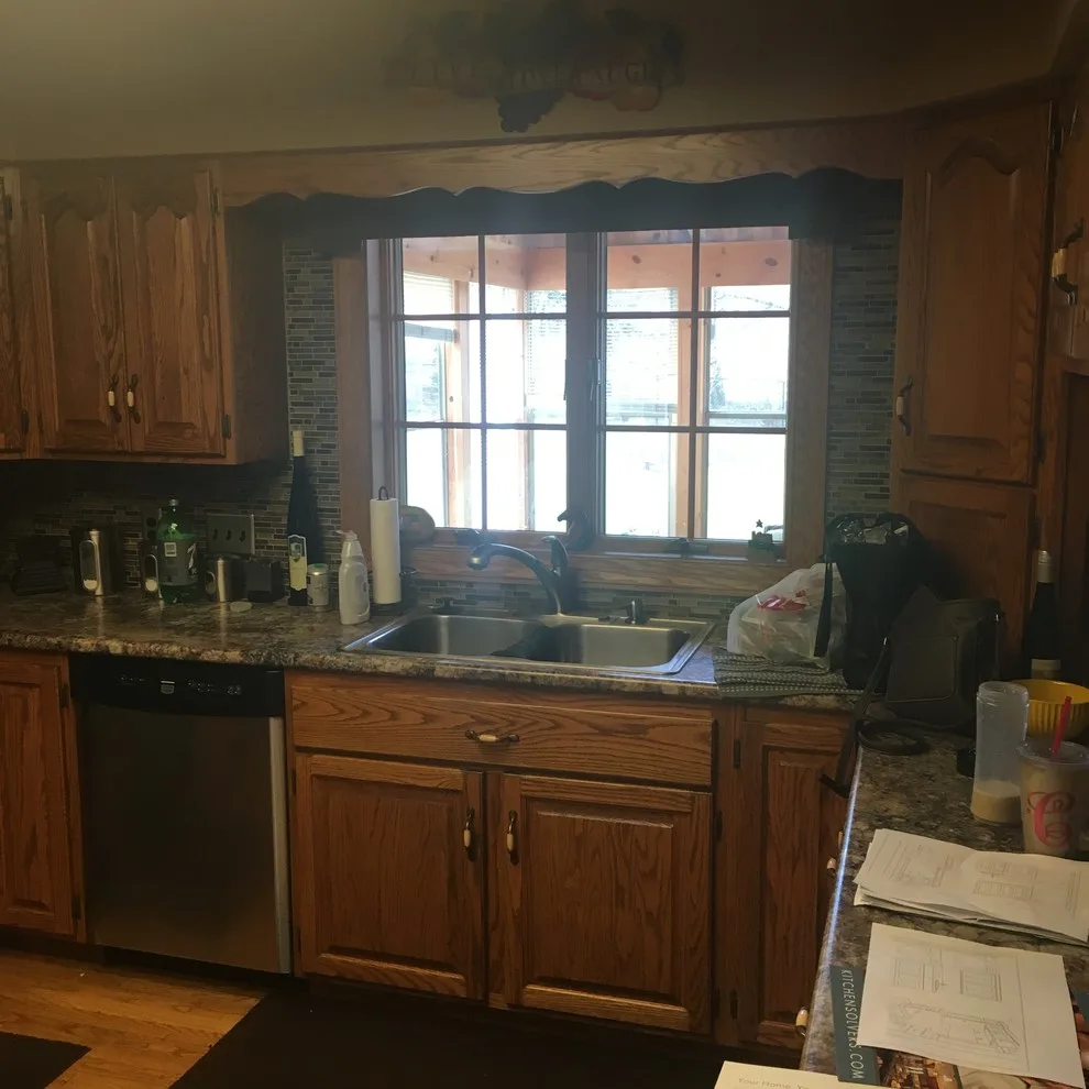 Biscuit-Colored Kitchen Renovation with Chocolate Glaze by Kitchen Solvers Of Eau Claire - Photo 15