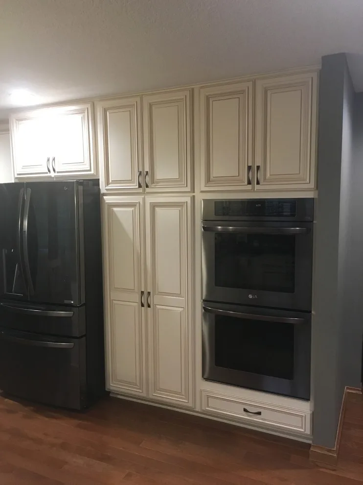Biscuit-Colored Kitchen Renovation with Chocolate Glaze by Kitchen Solvers Of Eau Claire - Photo 13