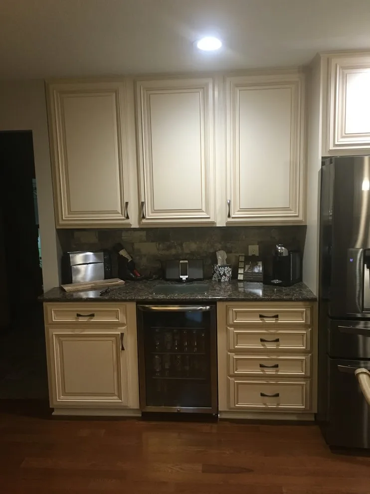 Biscuit-Colored Kitchen Renovation with Chocolate Glaze by Kitchen Solvers Of Eau Claire - Photo 10