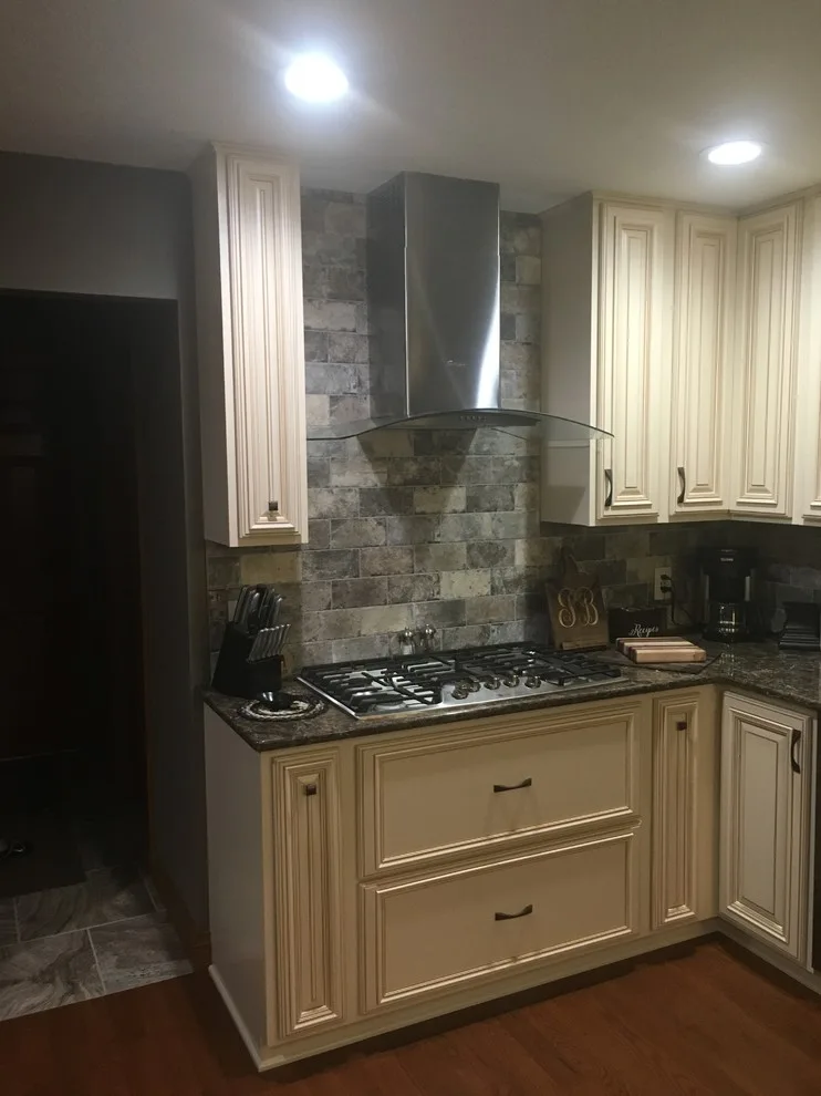 Biscuit-Colored Kitchen Renovation with Chocolate Glaze by Kitchen Solvers Of Eau Claire - Photo 17