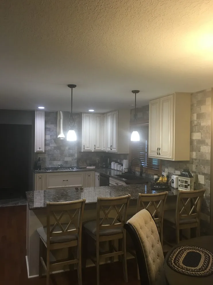 Biscuit-Colored Kitchen Renovation with Chocolate Glaze by Kitchen Solvers Of Eau Claire - Photo 18