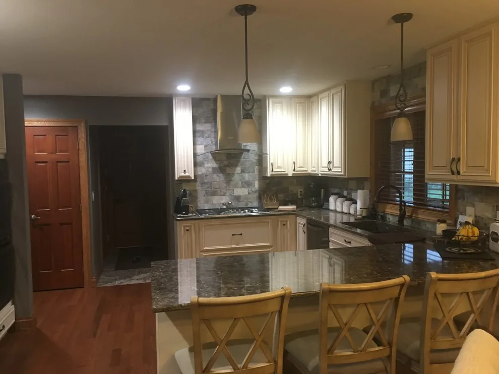 Biscuit-Colored Kitchen Renovation with Chocolate Glaze by Kitchen Solvers Of Eau Claire - Photo 9