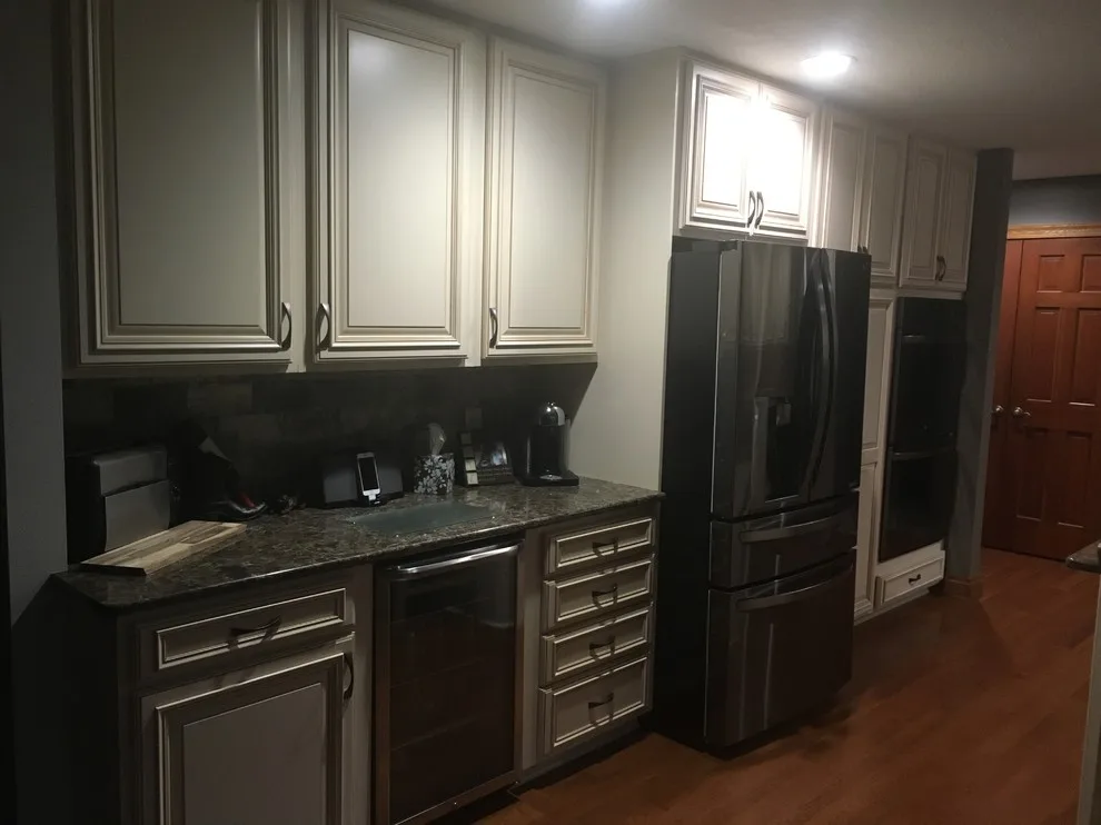 Biscuit-Colored Kitchen Renovation with Chocolate Glaze by Kitchen Solvers Of Eau Claire - Photo 20