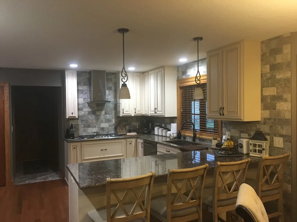 Biscuit-Colored Kitchen Renovation with Chocolate Glaze by Kitchen Solvers Of Eau Claire - Photo 6