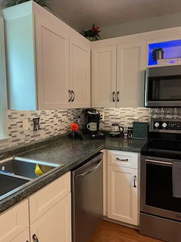 Hybrid Kitchen Renovation for Transitioning Spaces by Kitchen Solvers Of Spring Hill - Photo 12