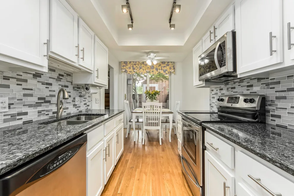 White Lowland Door Transitional Kitchen Renovation by Kitchen Solvers Of Oklahoma City - Photo 6
