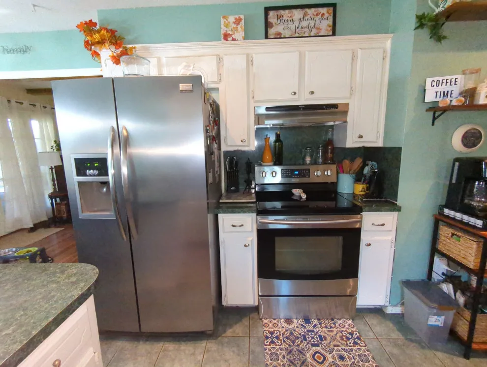 Mythic Blue Cabinets Kitchen Renovation Complete by Kitchen Solvers Of Oklahoma City - Photo 11