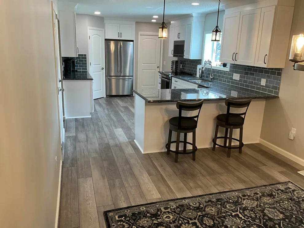 Kitchen Remodel Featuring New Polar White Cabinets by Kitchen Solvers Of Fort Wayne & Toledo - Photo 3