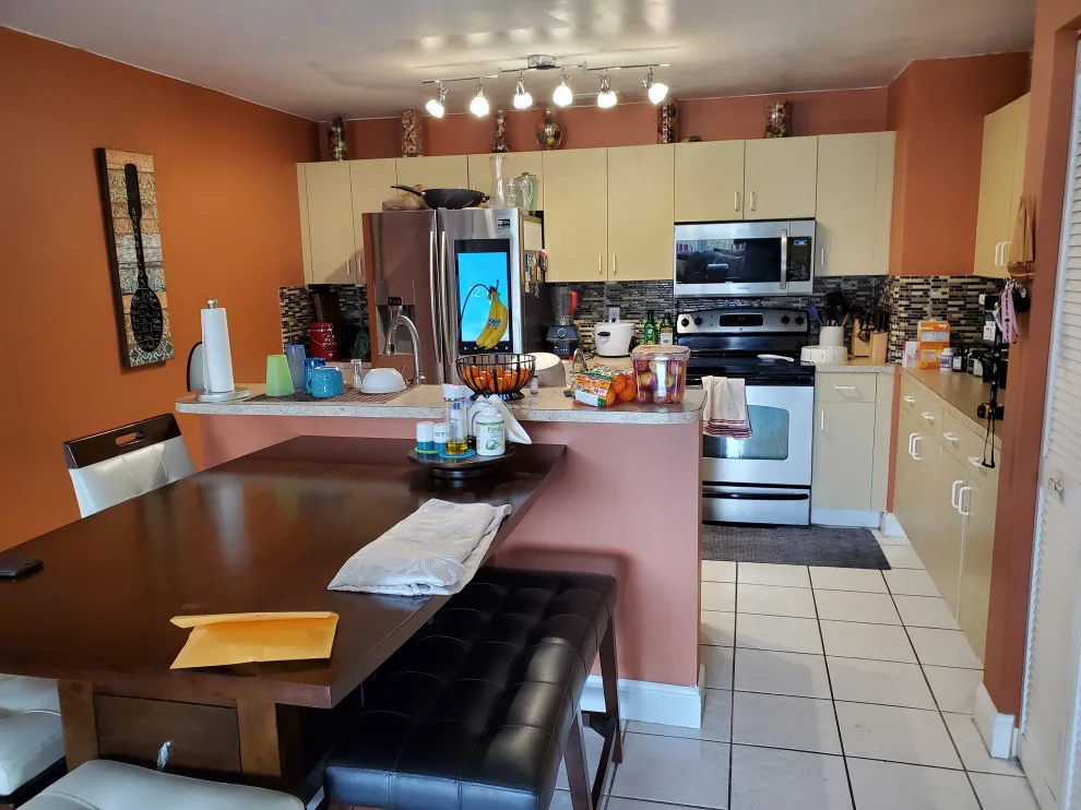 Modern Kitchen Renovation Featuring New White Cabinets by Kitchen Solvers Of Fort Lauderdale - Photo 13