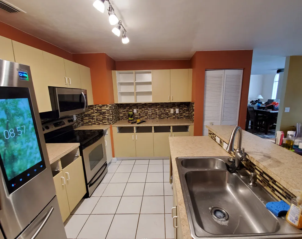 Modern Kitchen Renovation Featuring New White Cabinets by Kitchen Solvers Of Fort Lauderdale - Photo 16