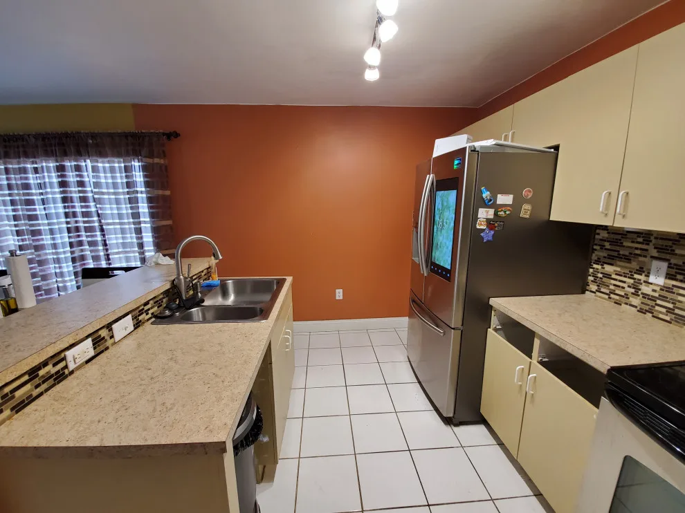 Modern Kitchen Renovation Featuring New White Cabinets by Kitchen Solvers Of Fort Lauderdale - Photo 8