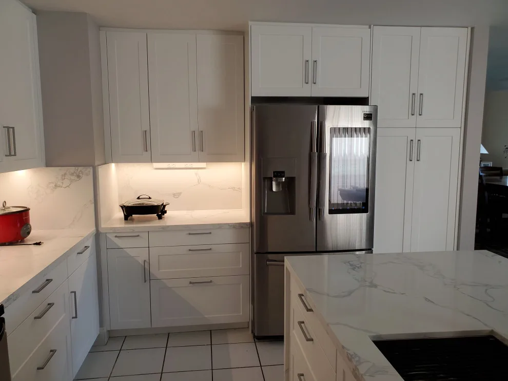 Modern Kitchen Renovation Featuring New White Cabinets by Kitchen Solvers Of Fort Lauderdale - Photo 9