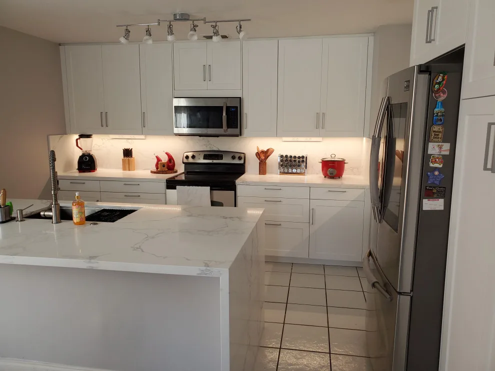 Modern Kitchen Renovation Featuring New White Cabinets by Kitchen Solvers Of Fort Lauderdale - Photo 11