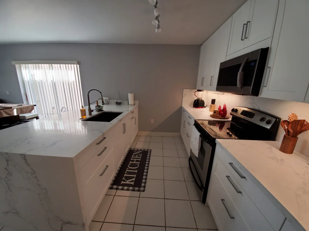 Modern Kitchen Renovation Featuring New White Cabinets by Kitchen Solvers Of Fort Lauderdale - Photo 12