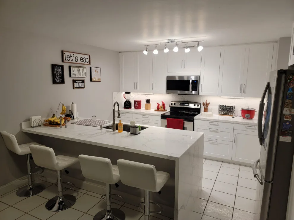 Modern Kitchen Renovation Featuring New White Cabinets by Kitchen Solvers Of Fort Lauderdale - Photo 3