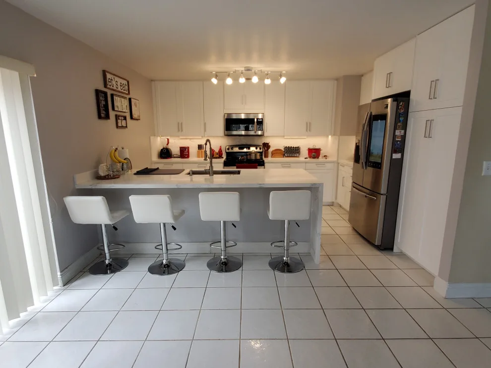 Modern Kitchen Renovation Featuring New White Cabinets by Kitchen Solvers Of Fort Lauderdale - Photo 14