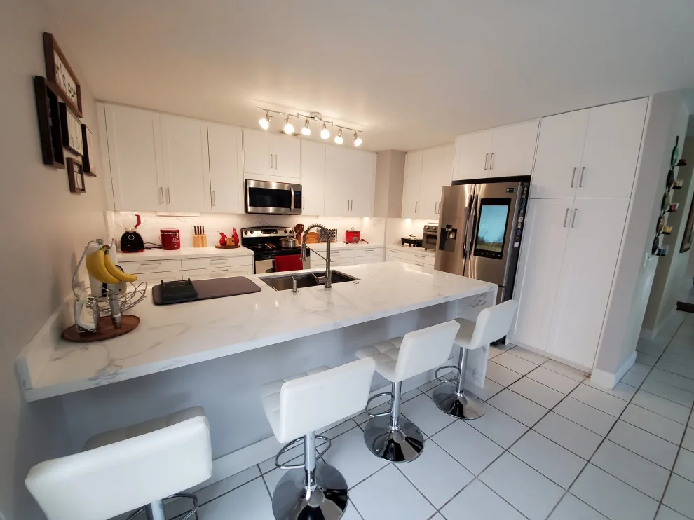Modern Kitchen Renovation Featuring New White Cabinets by Kitchen Solvers Of Fort Lauderdale - Photo 10