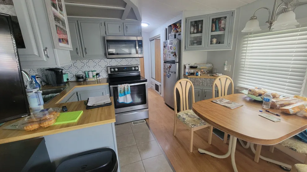 Modern Kitchen Renovation Featuring New White Cabinets by Kitchen Solvers Of Orlando - Photo 3