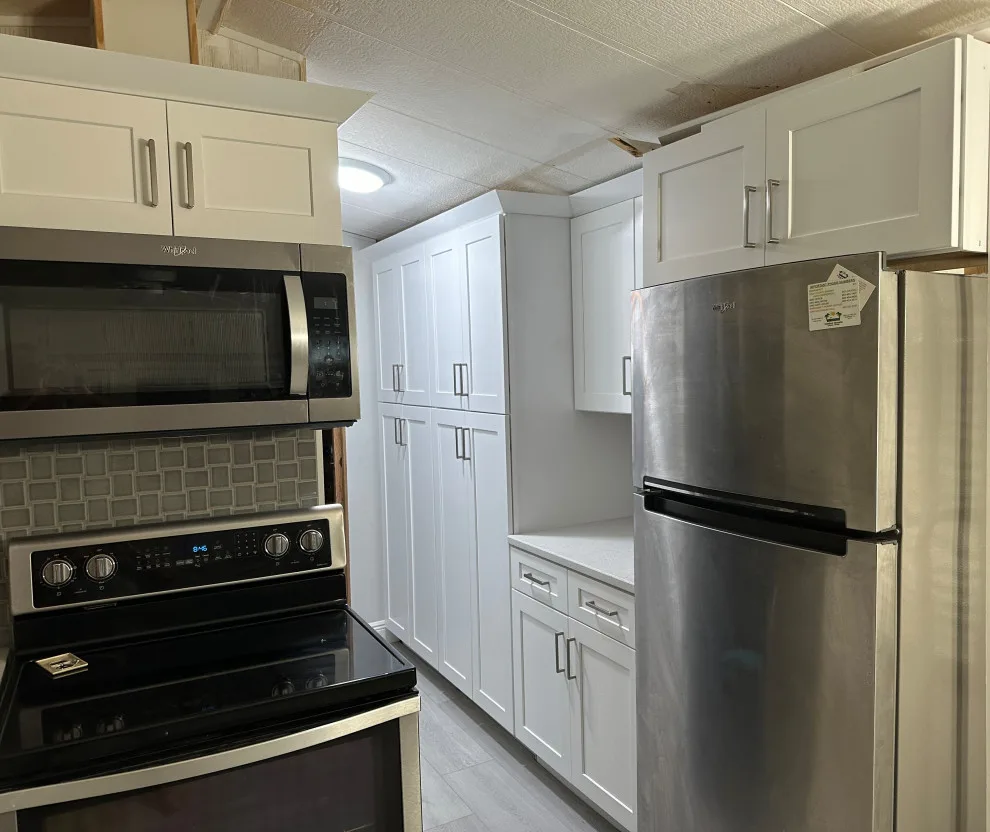 Modern Kitchen Renovation Featuring New White Cabinets by Kitchen Solvers Of Orlando - Photo 2