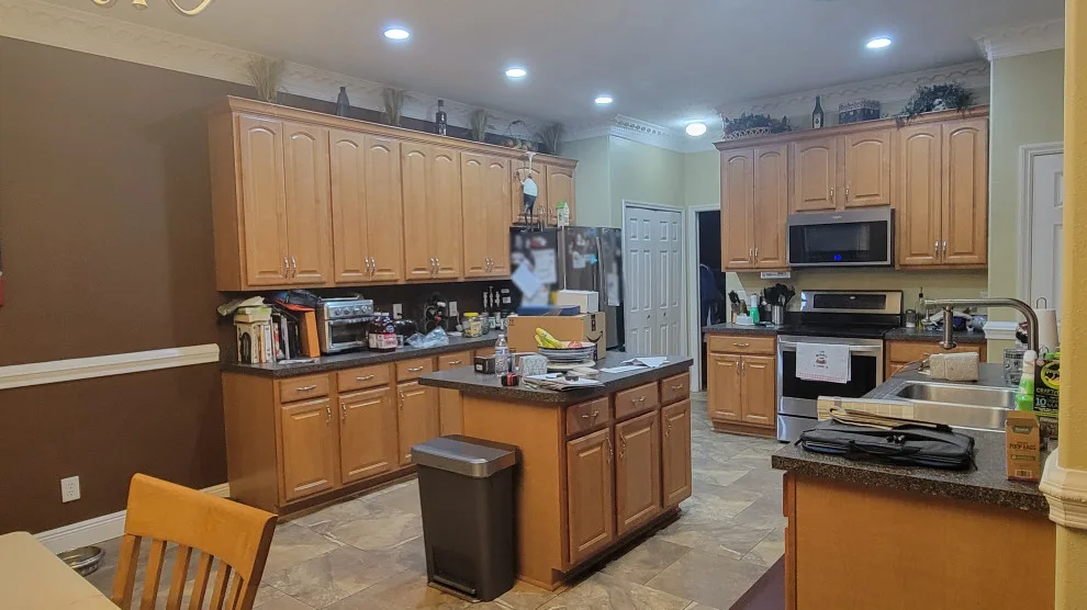 Updated Kitchen Renovation Featuring New White Raised Panel Doors by Kitchen Solvers Of Orlando - Photo 2