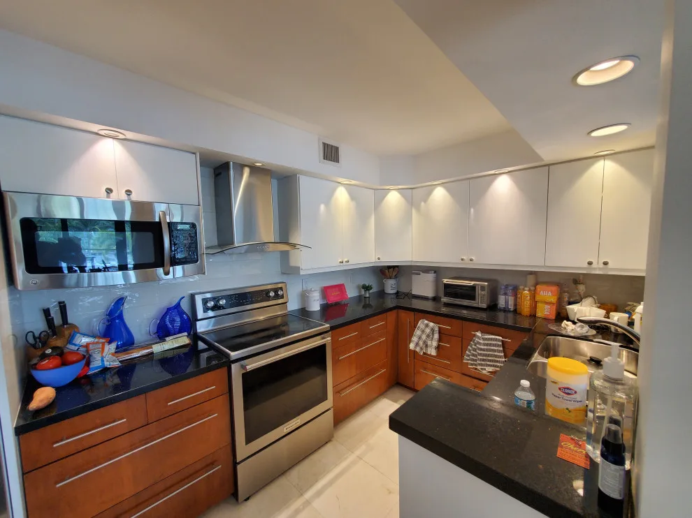 Contemporary Kitchen Renovation Featuring a Glossy White Finish by Kitchen Solvers Of Fort Lauderdale - Photo 11