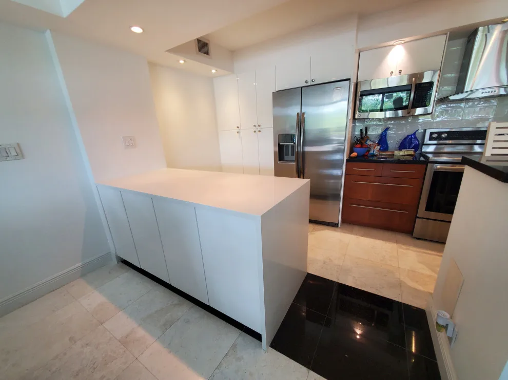 Contemporary Kitchen Renovation Featuring a Glossy White Finish by Kitchen Solvers Of Fort Lauderdale - Photo 9