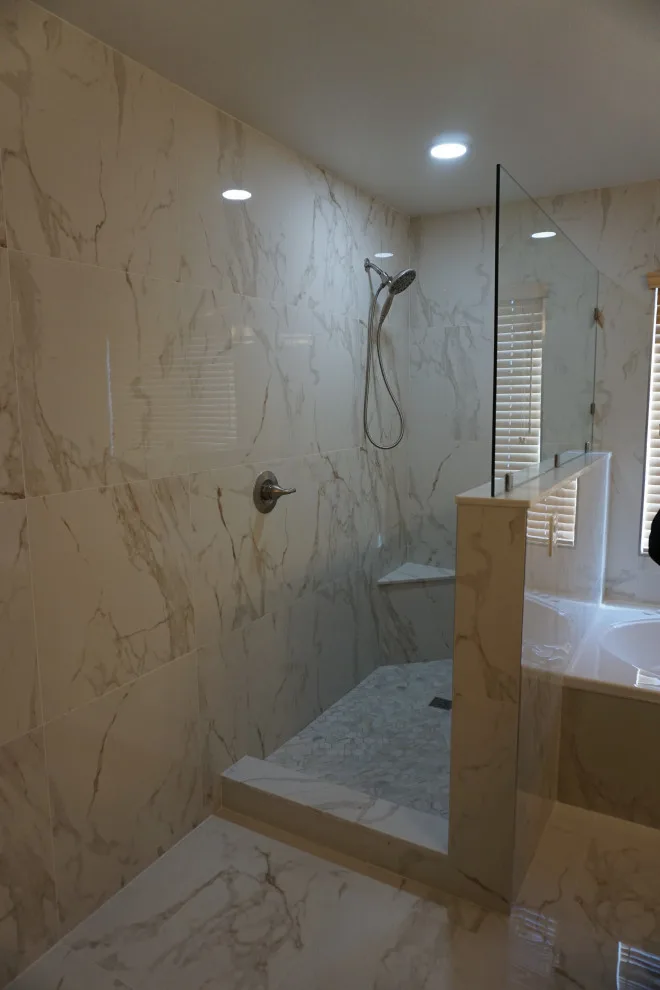 Silver and white marble bathroom renovation by Amos Tile LV - Photo 5